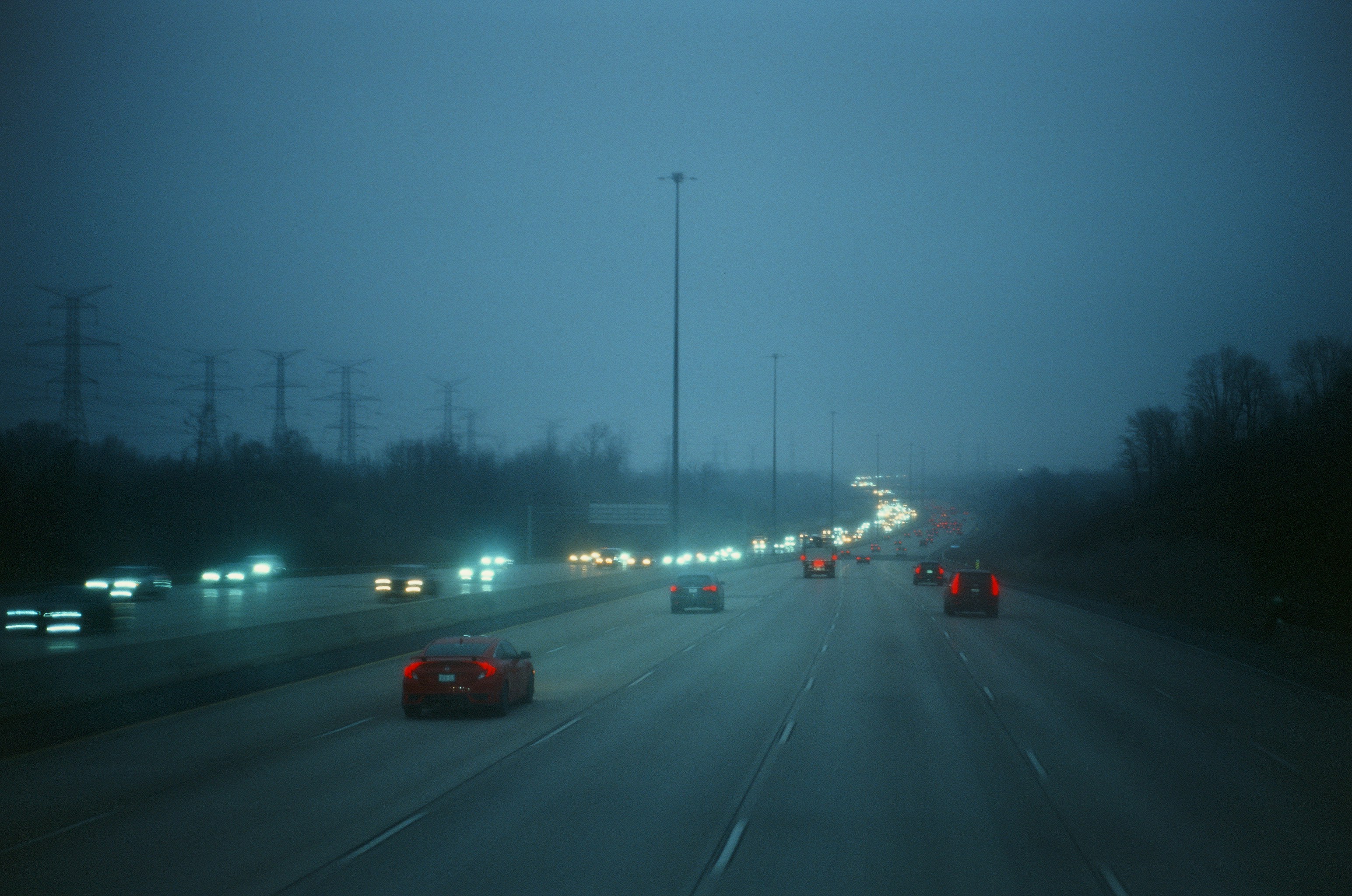 A blurry picture of a highway at night