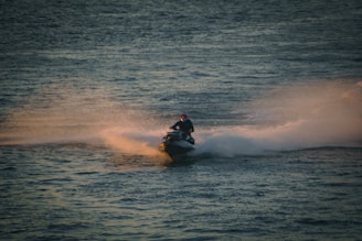 A man riding a jet ski on top of a body of water