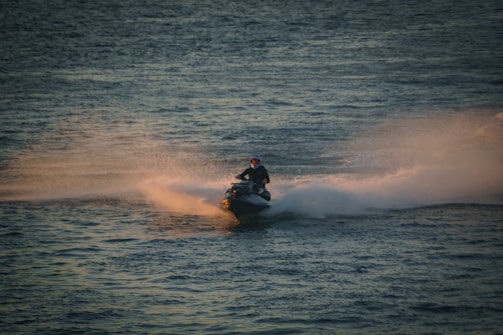 A man riding a jet ski on top of a body of water