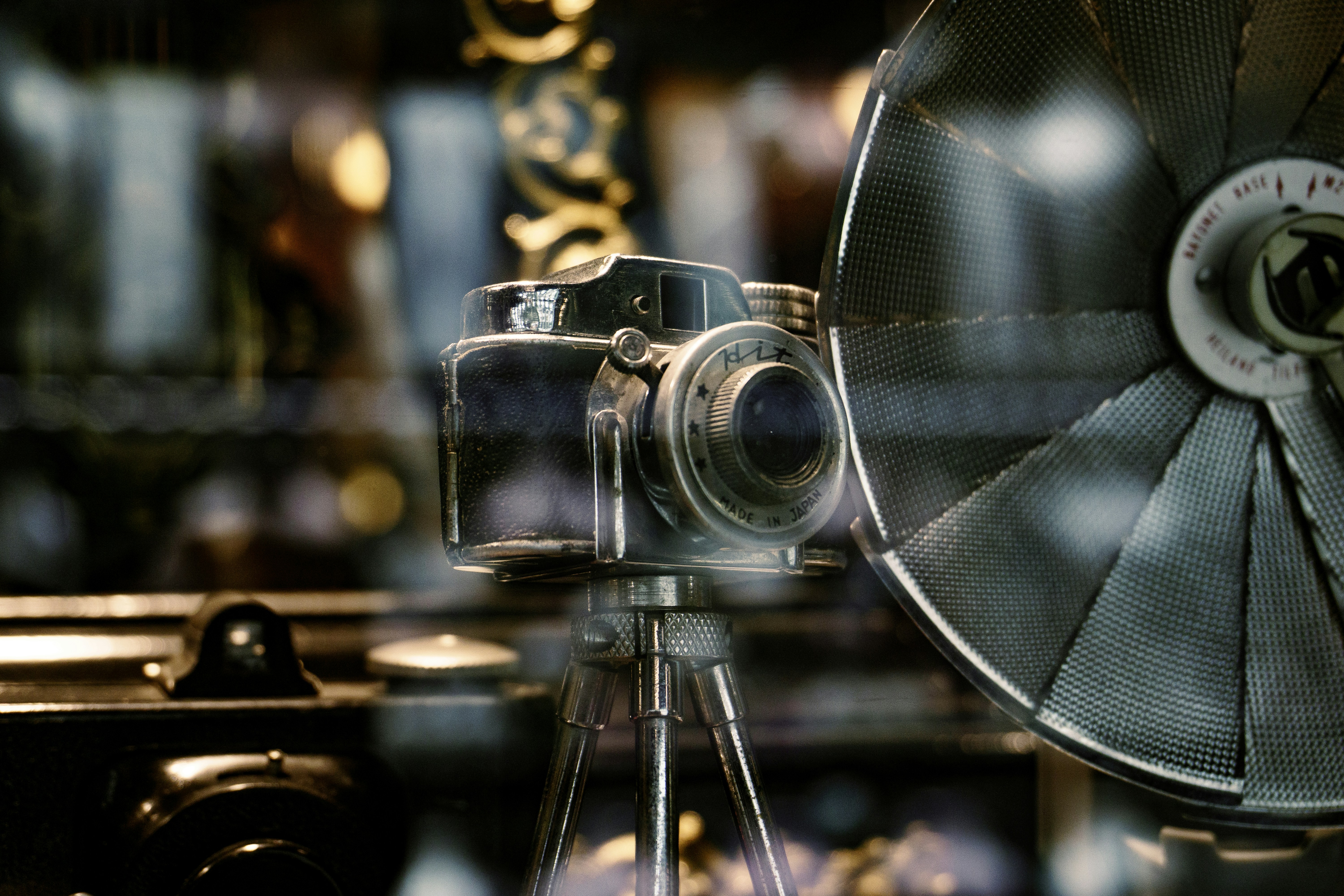 A close up of a camera on a tripod