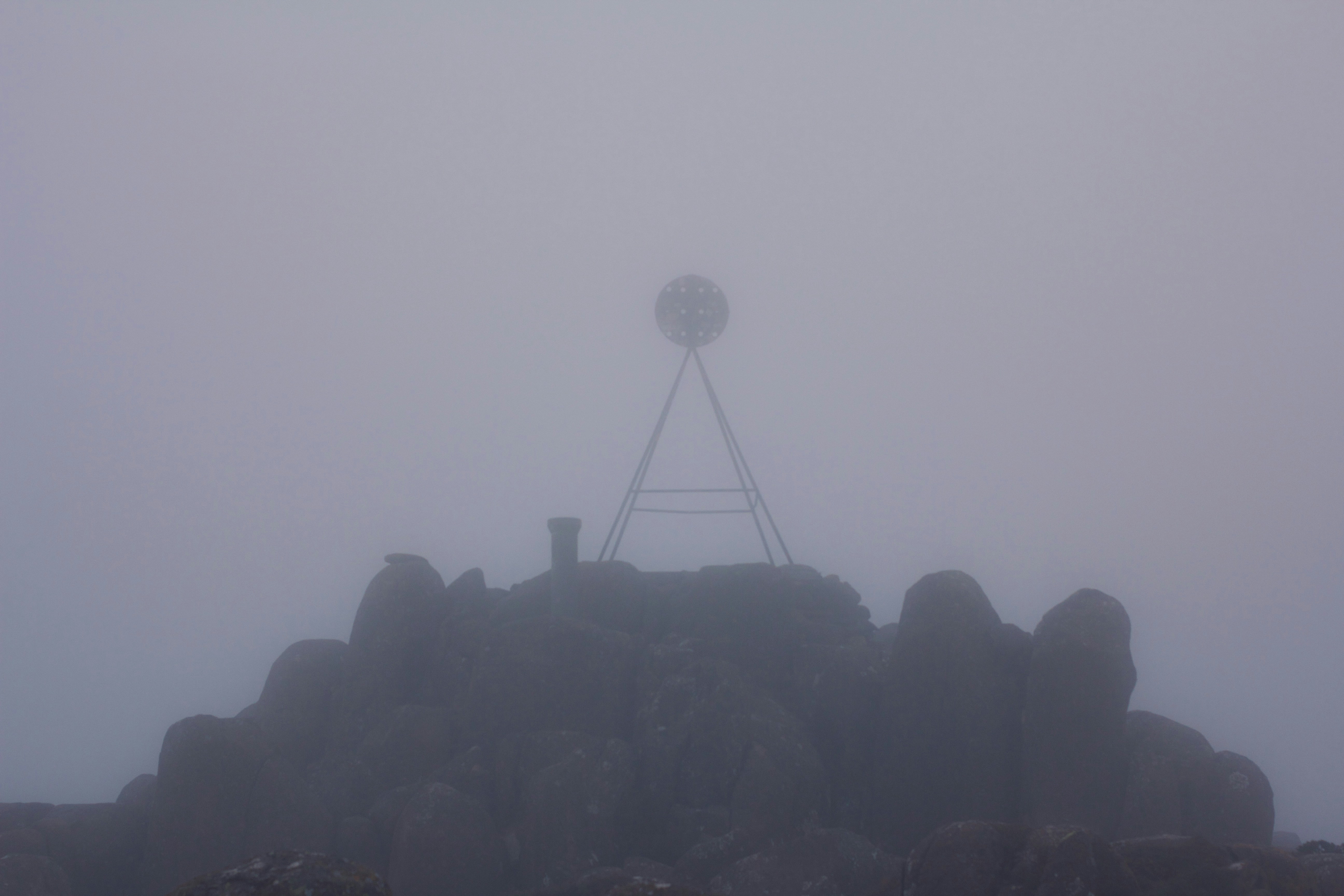 A satellite dish in the fog
