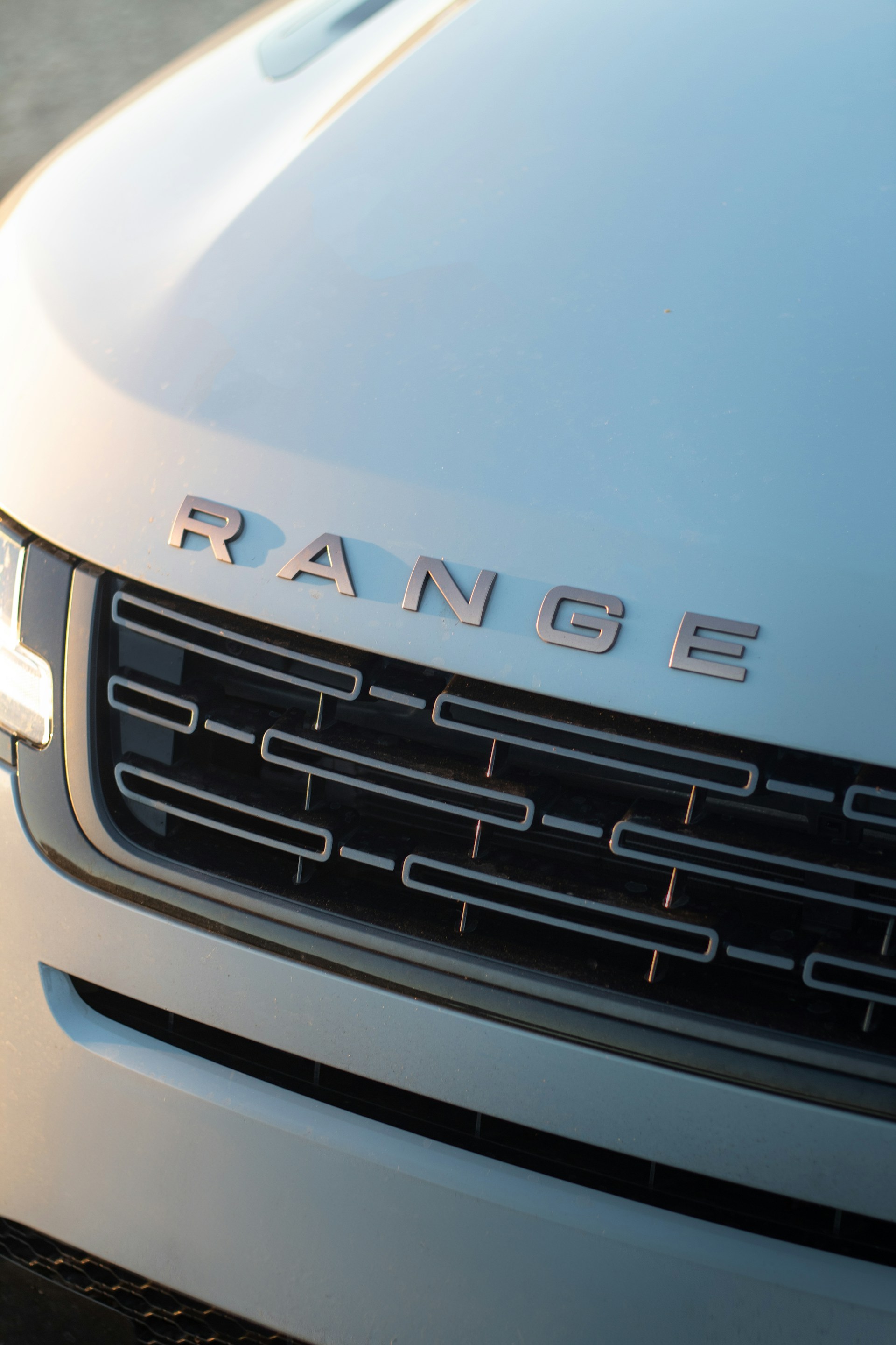 The front grille of a white range rover