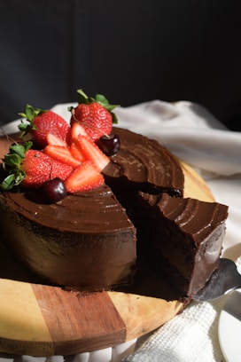 A piece of chocolate cake with strawberries on top