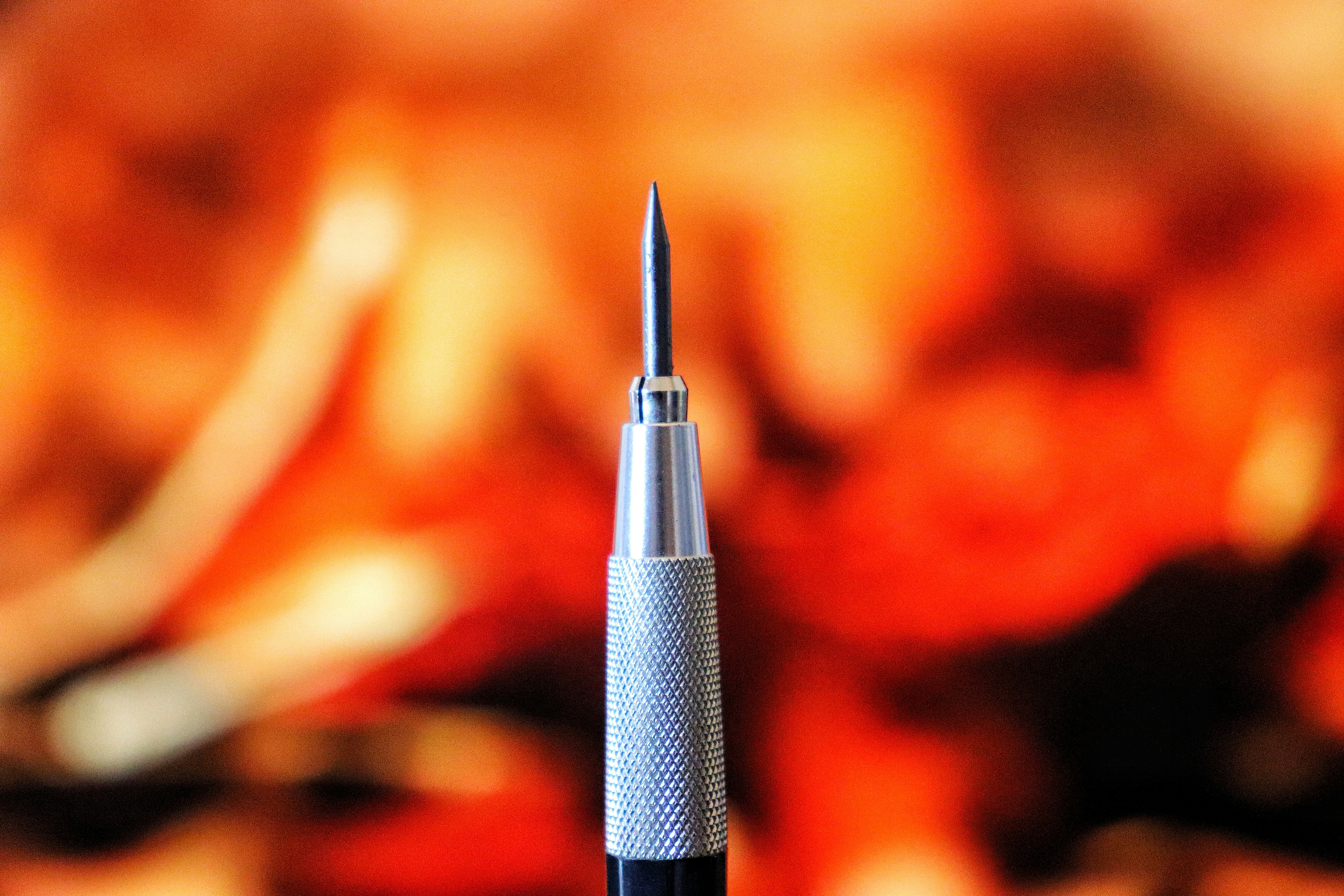 A pen sitting on top of a wooden table