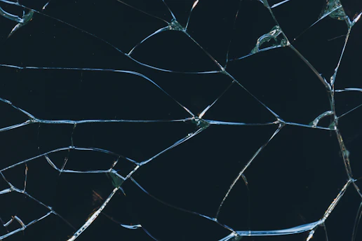 A close up of a broken glass window