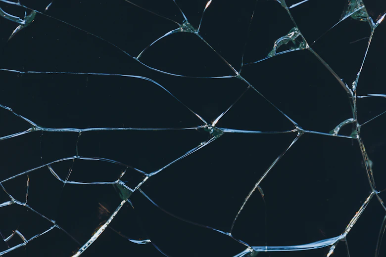 A close up of a broken glass window