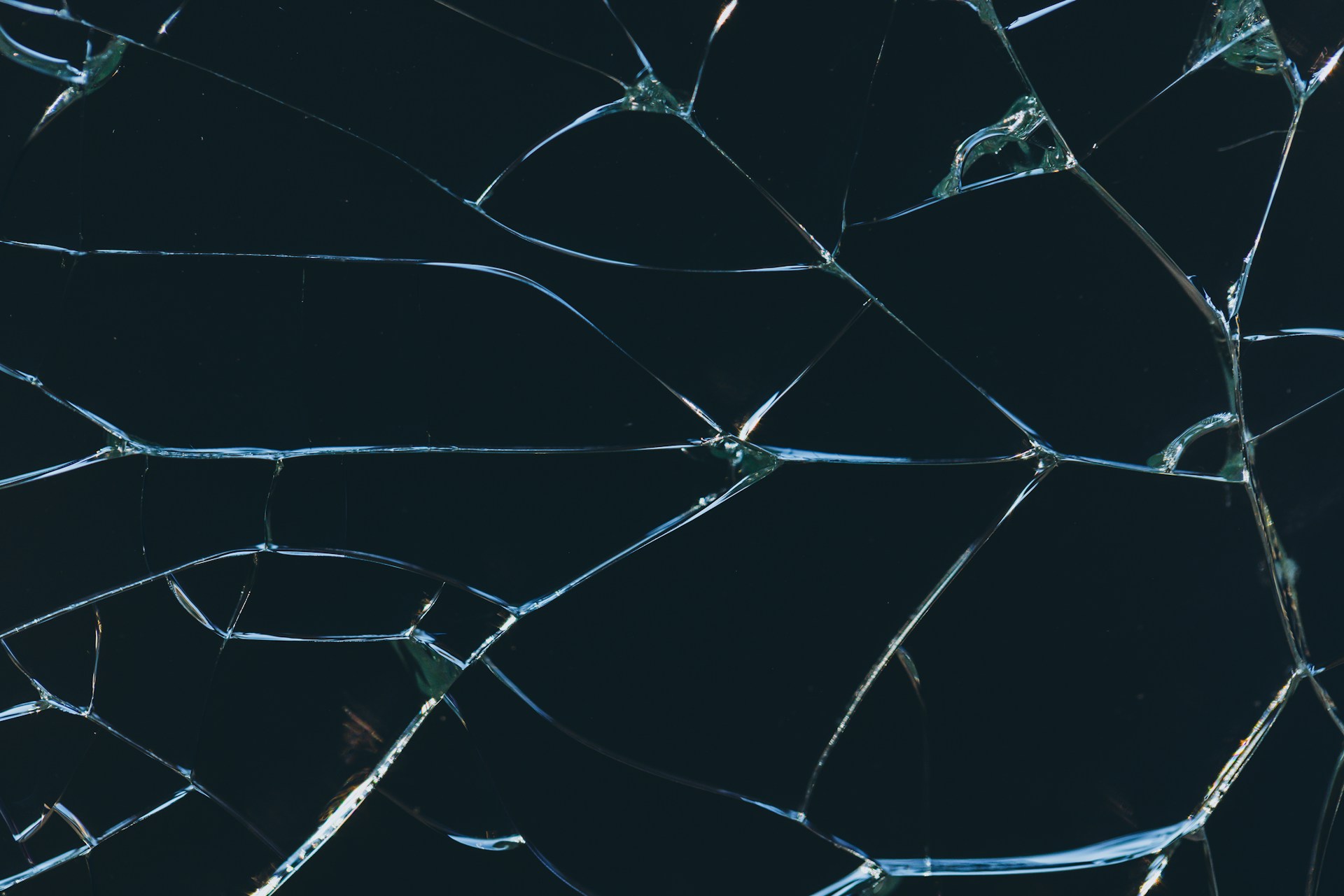 A close up of a broken glass window