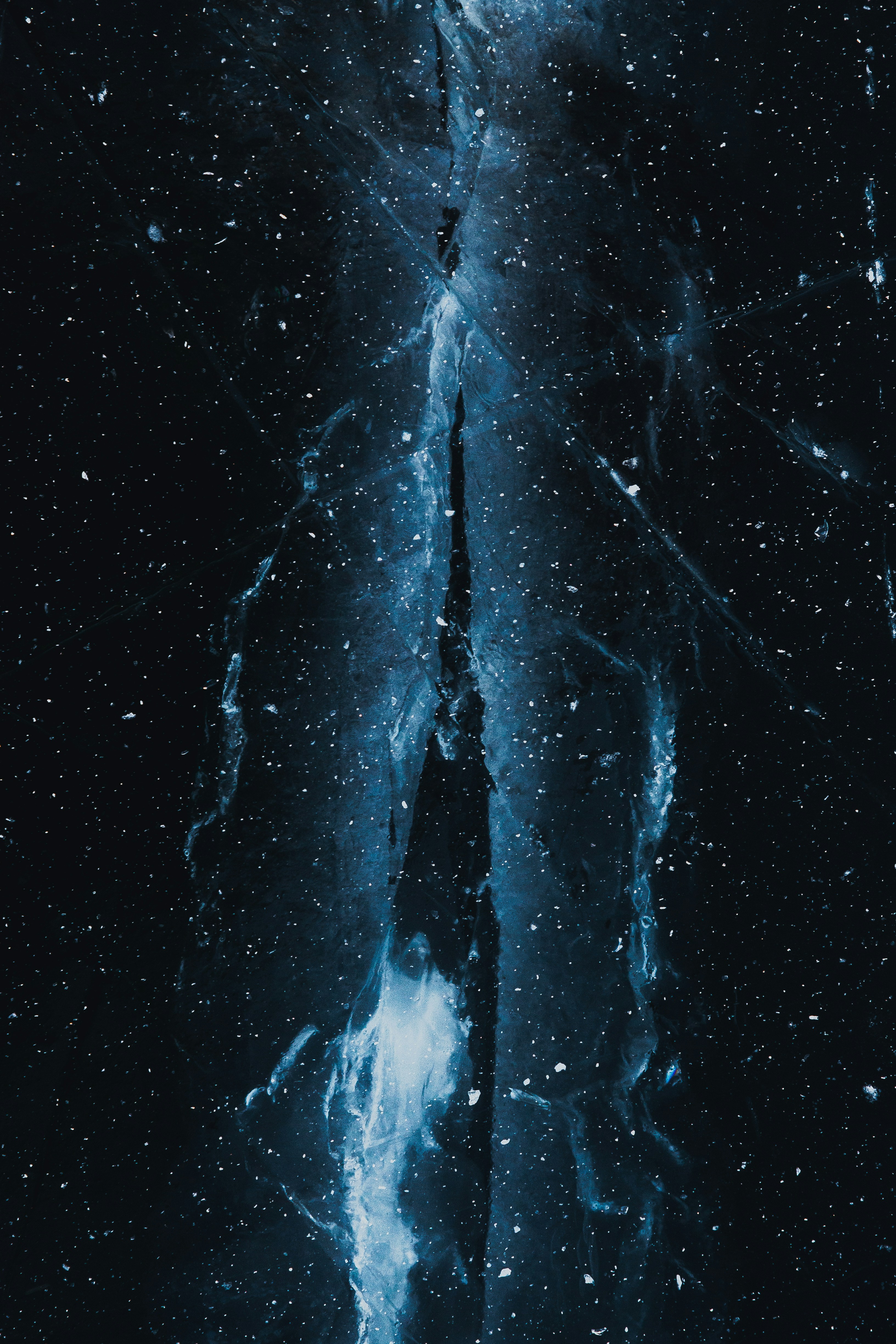 A person standing in the middle of a dark room