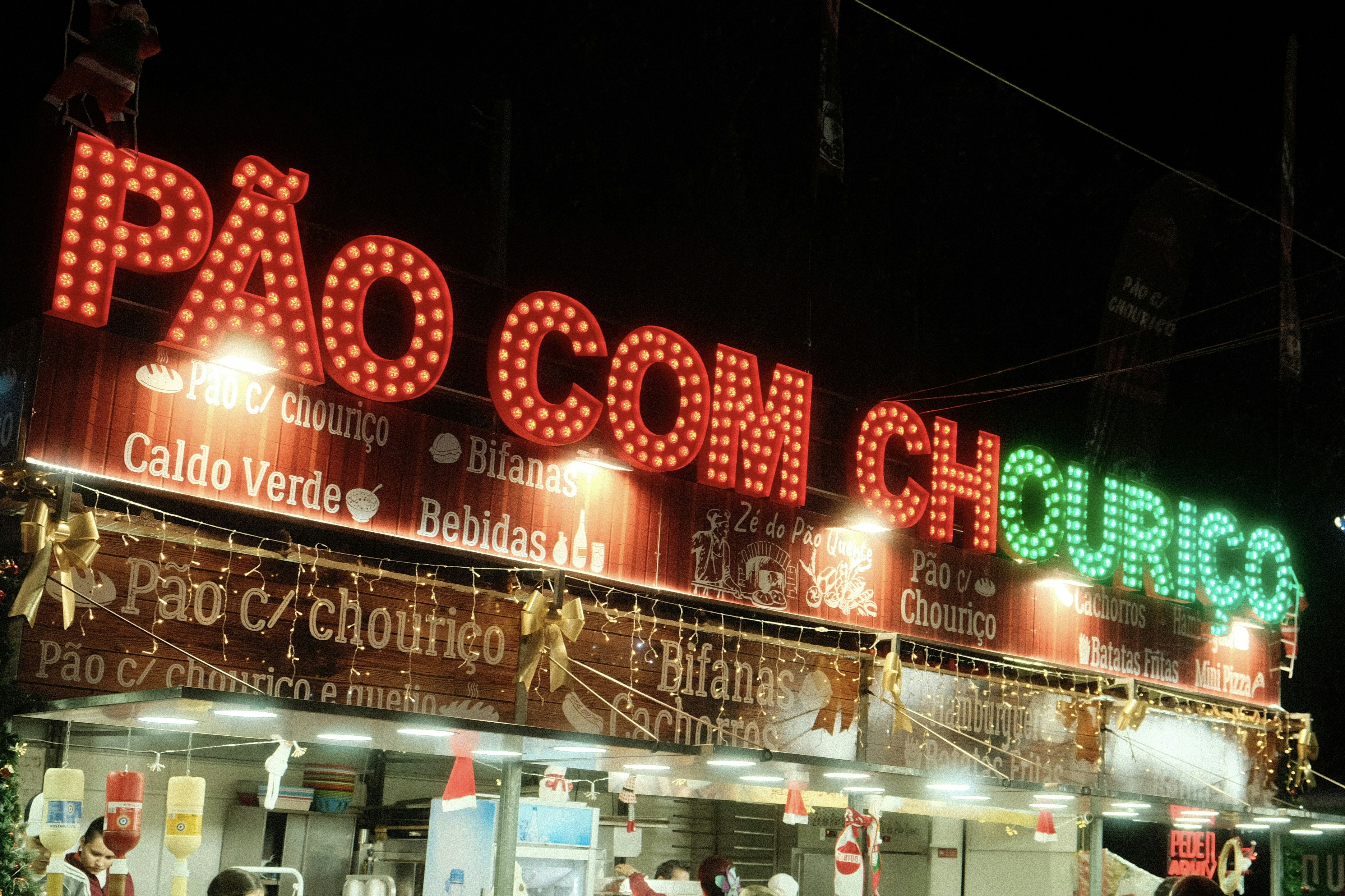 A neon sign on the side of a building