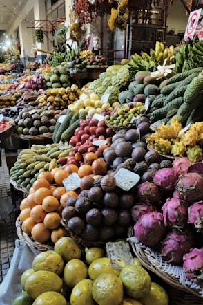 A large display of fruits and vegetables at a market