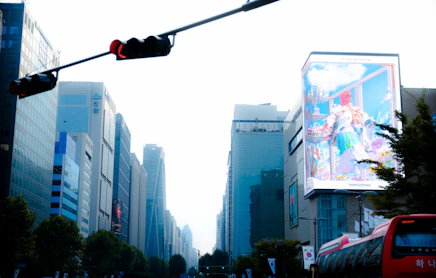 A traffic light hanging over a city street