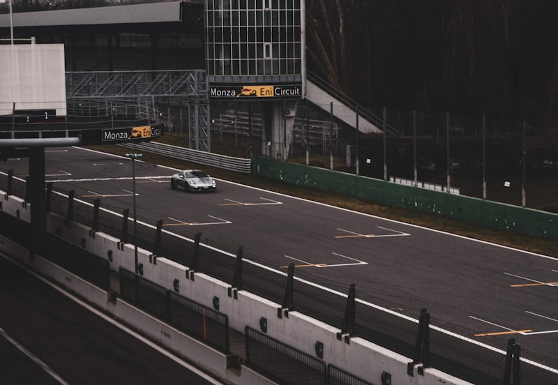 A car driving down a highway next to tall buildings