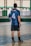 A man standing on a basketball court holding a basketball
