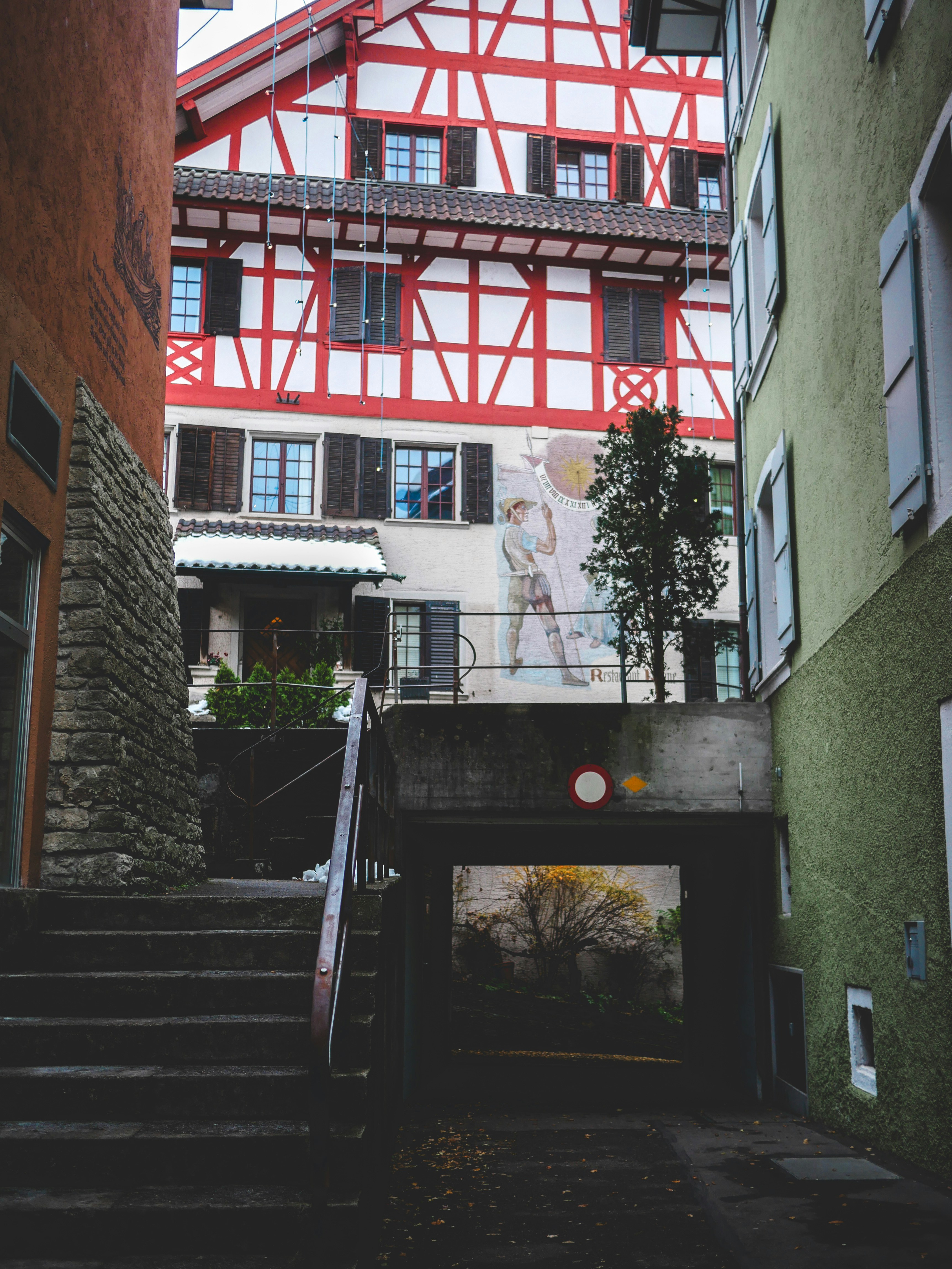 A staircase leading up to a red and white building