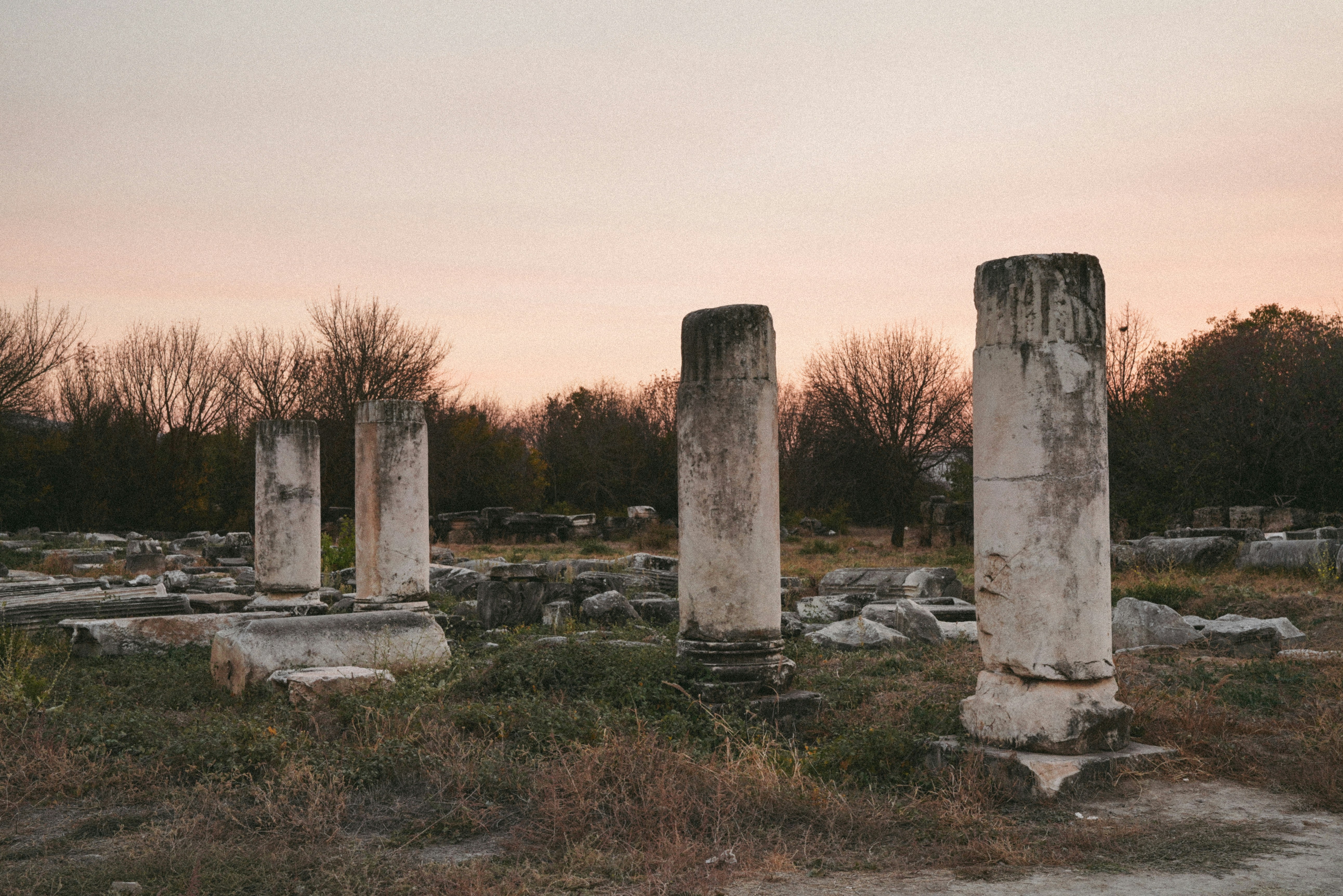 A group of stone pillars sitting in a field