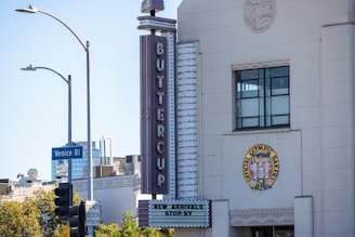 A tall white building with a clock on it's side
