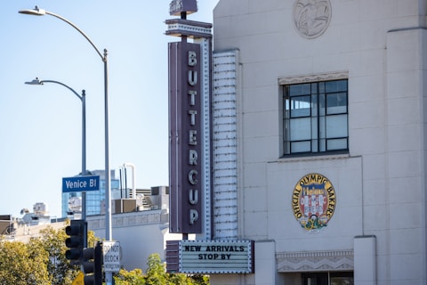 A tall white building with a clock on it's side