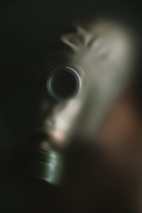A man wearing a gas mask in the dark