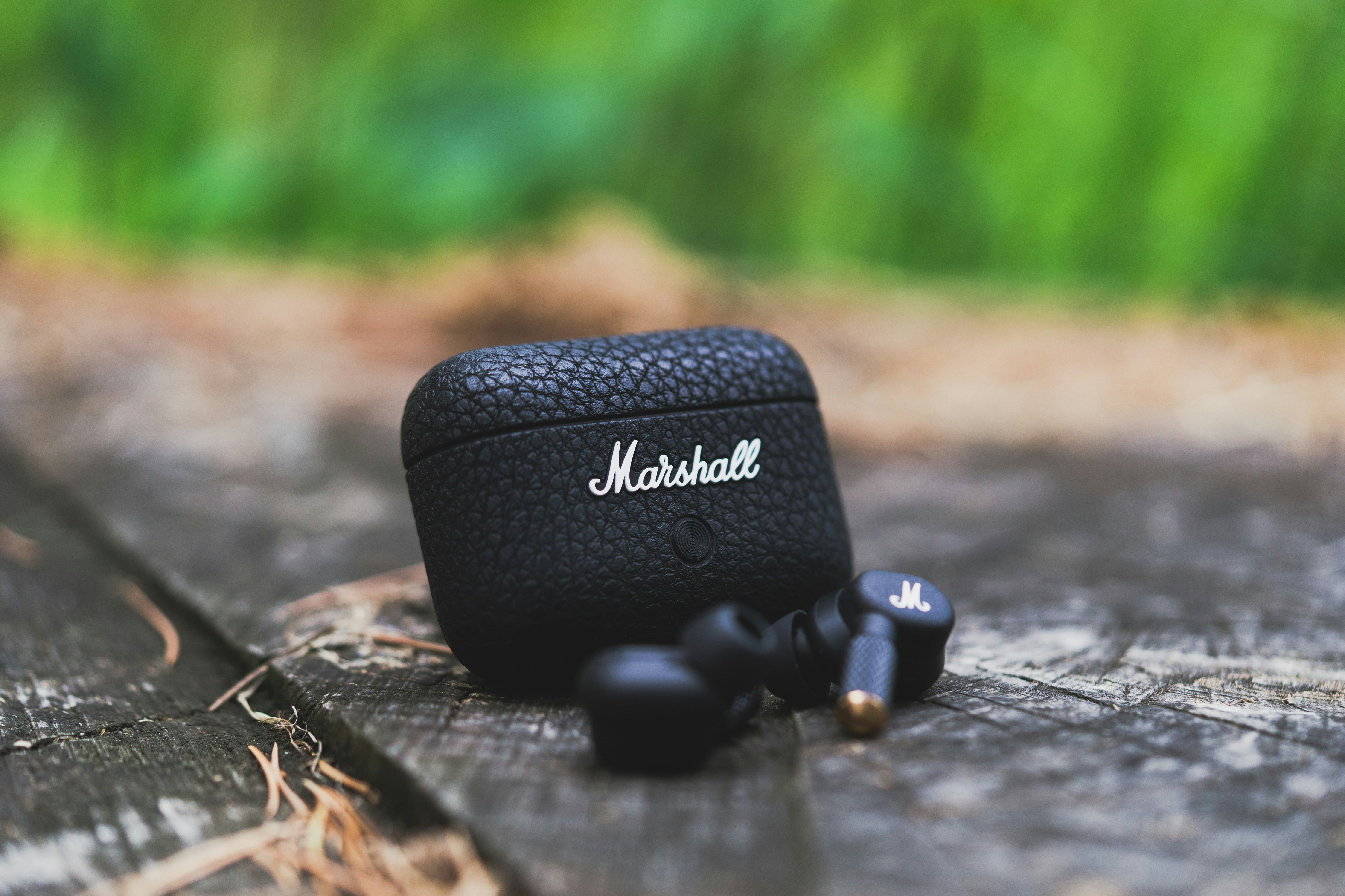 A pair of headphones sitting on top of a wooden table