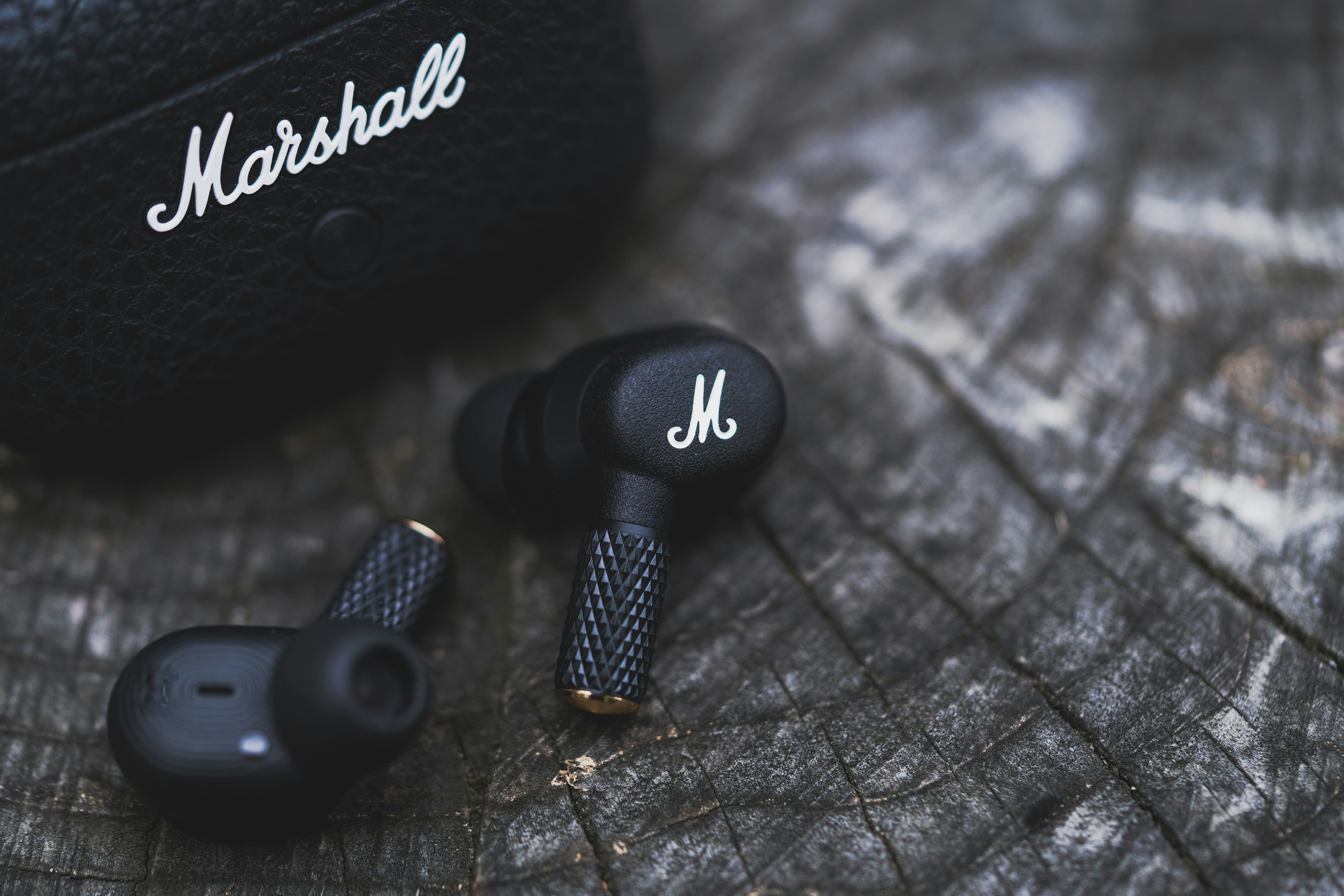 A pair of headphones sitting on top of a wooden table