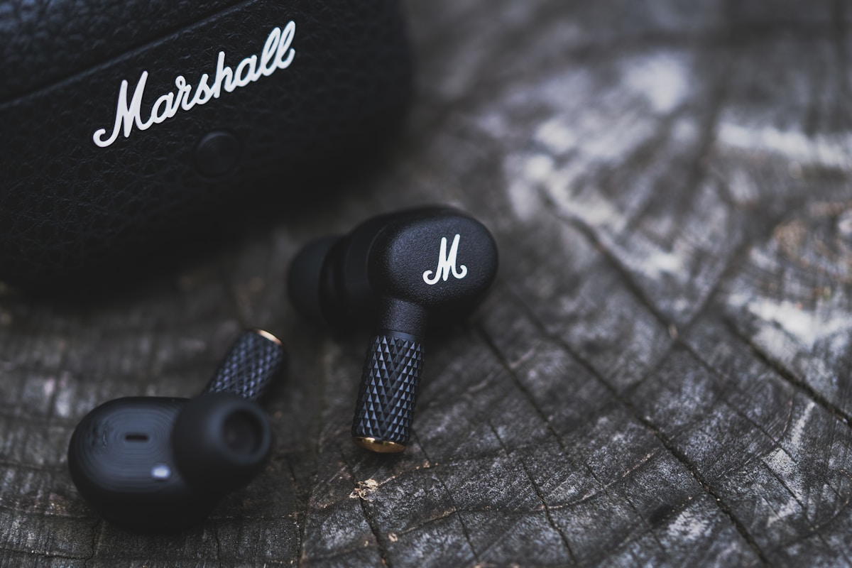 A pair of headphones sitting on top of a wooden table