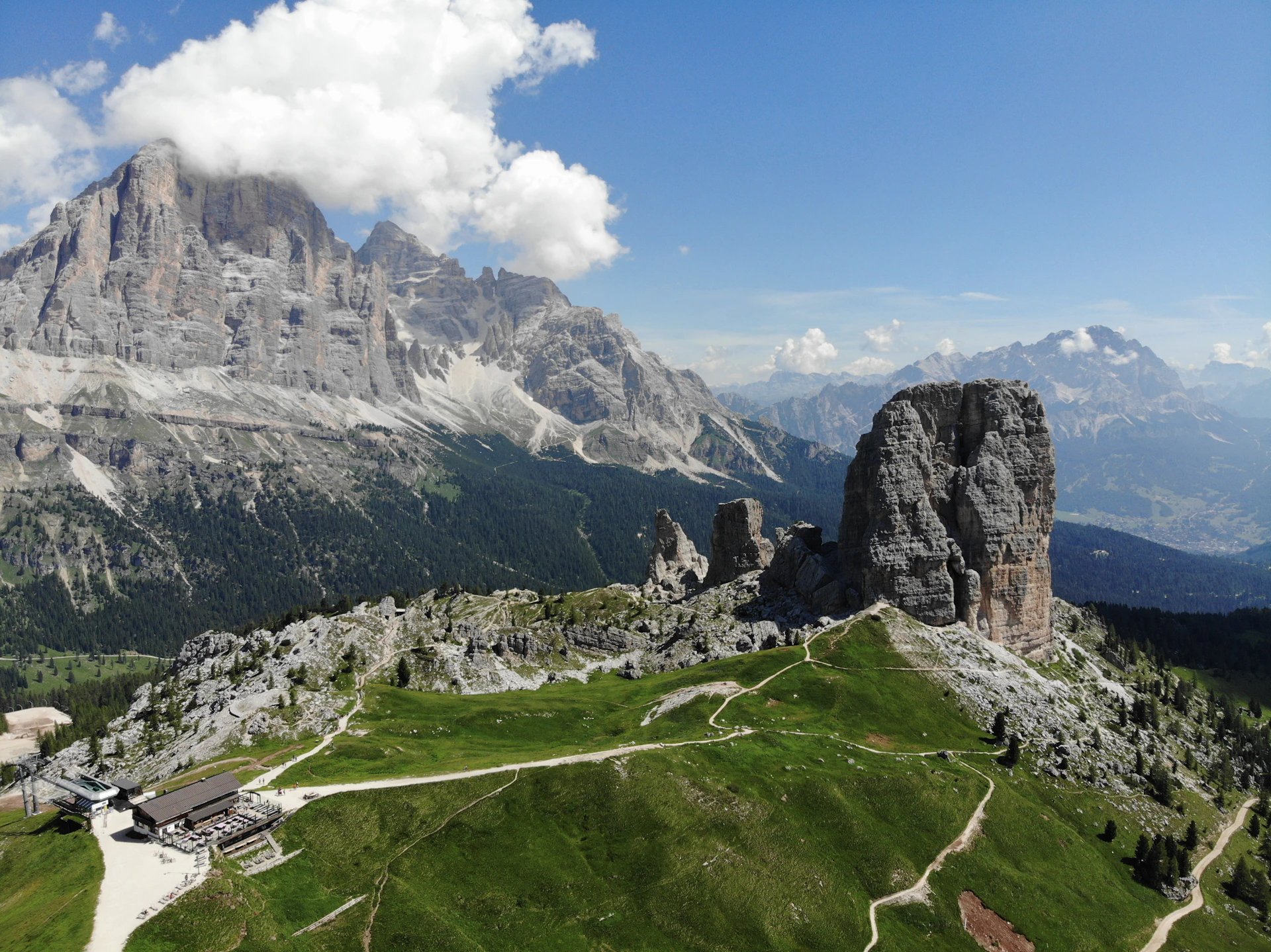 A scenic view of a mountain with a road going through it