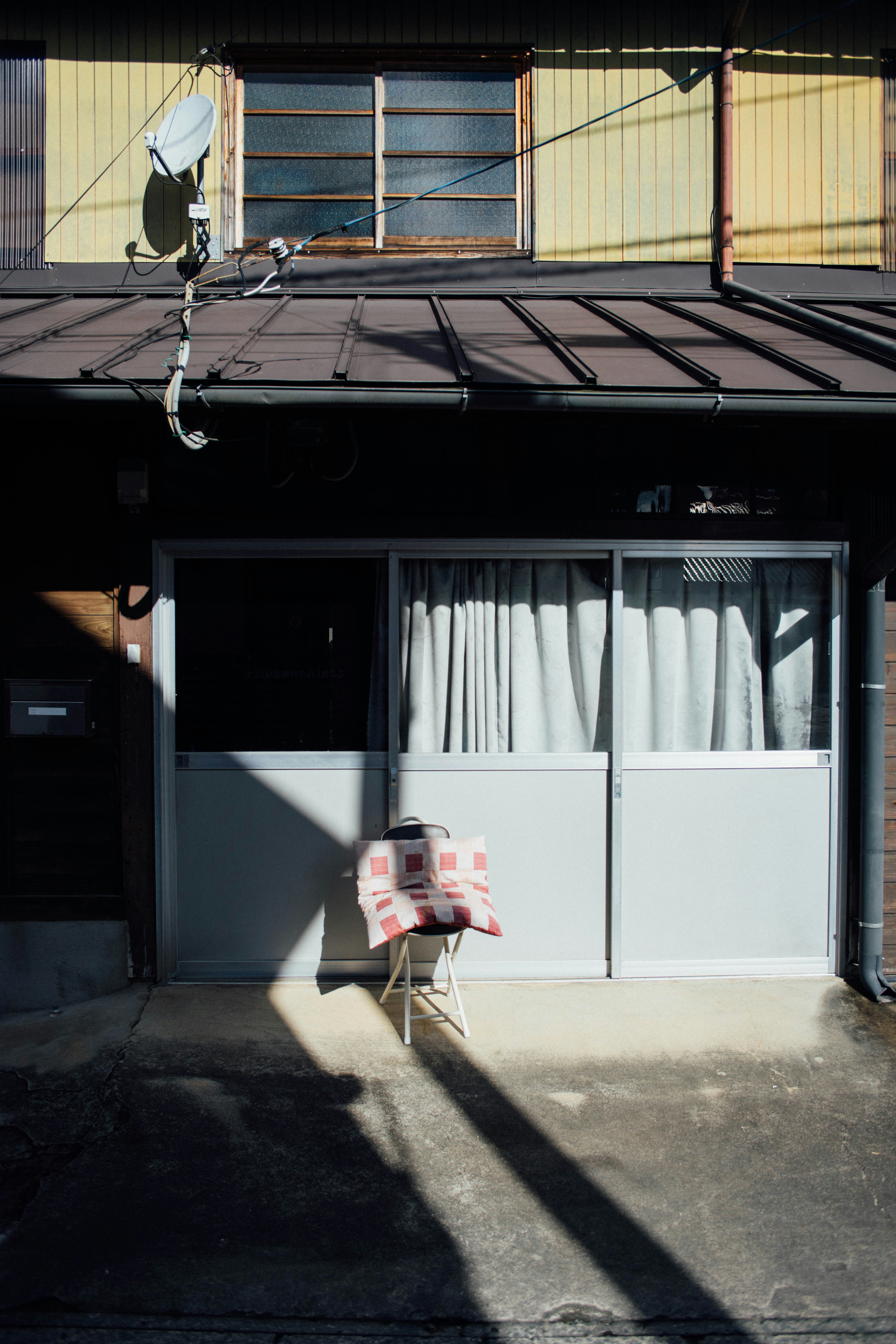 A chair sitting in front of a building