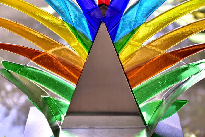 Colourful glass fin sculpture catching the light