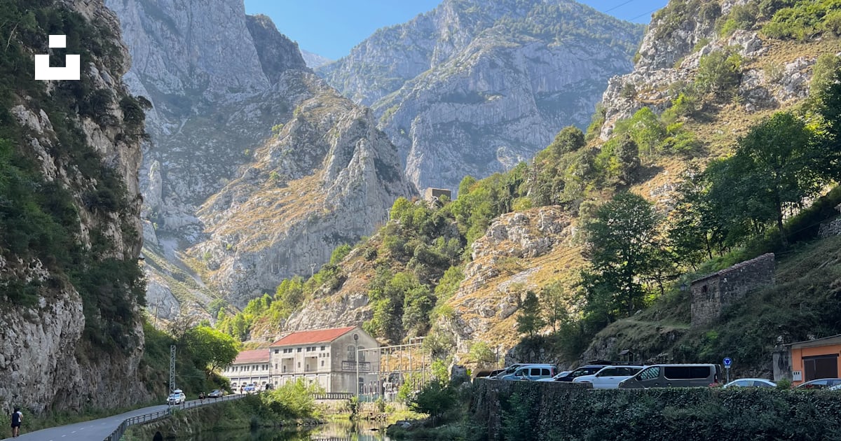 A river running through a lush green hillside photo – Free Picos de ...