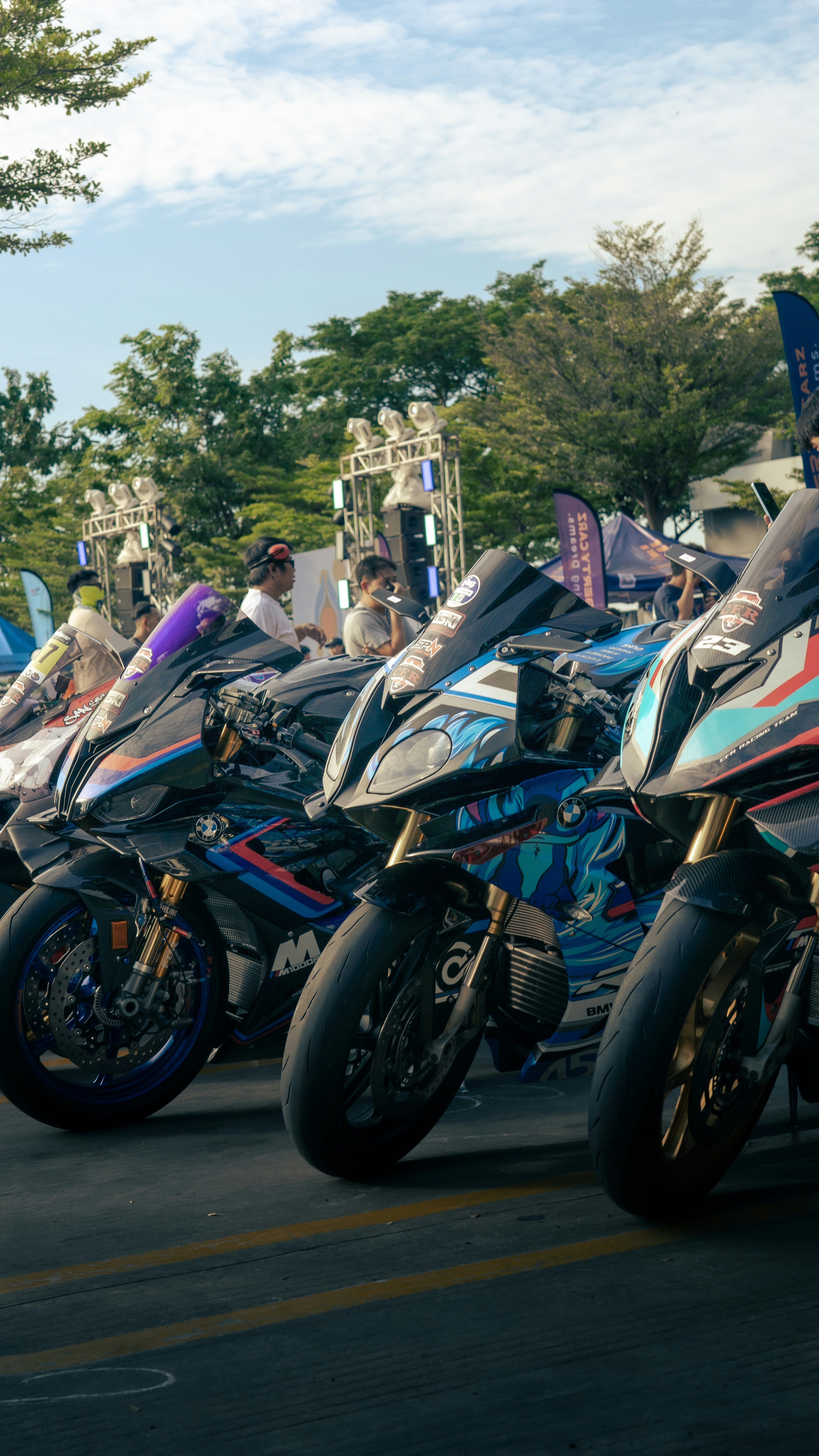 A group of motorcycles parked next to each other photo – Free Portrait ...