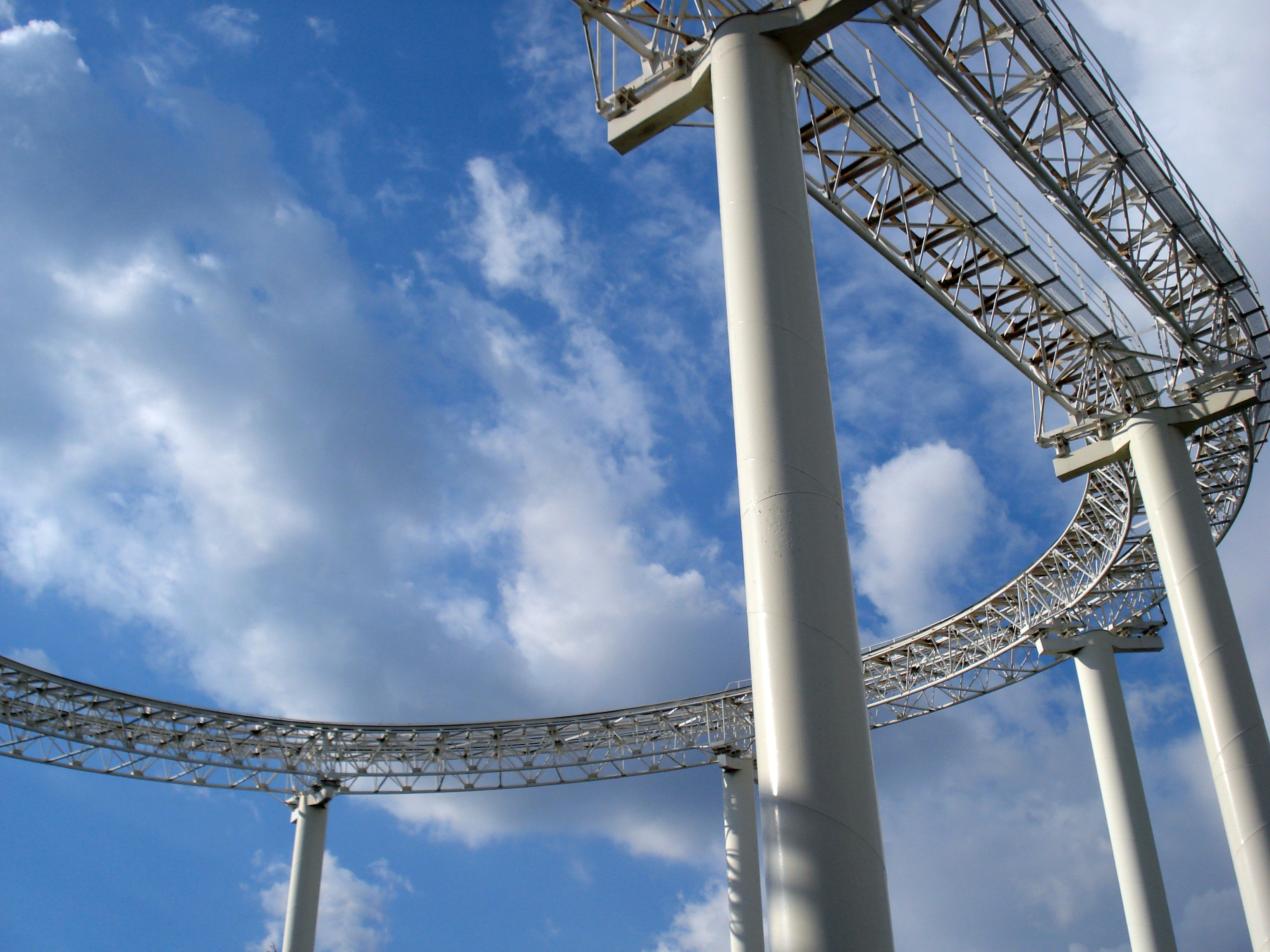 A tall metal structure with a sky background