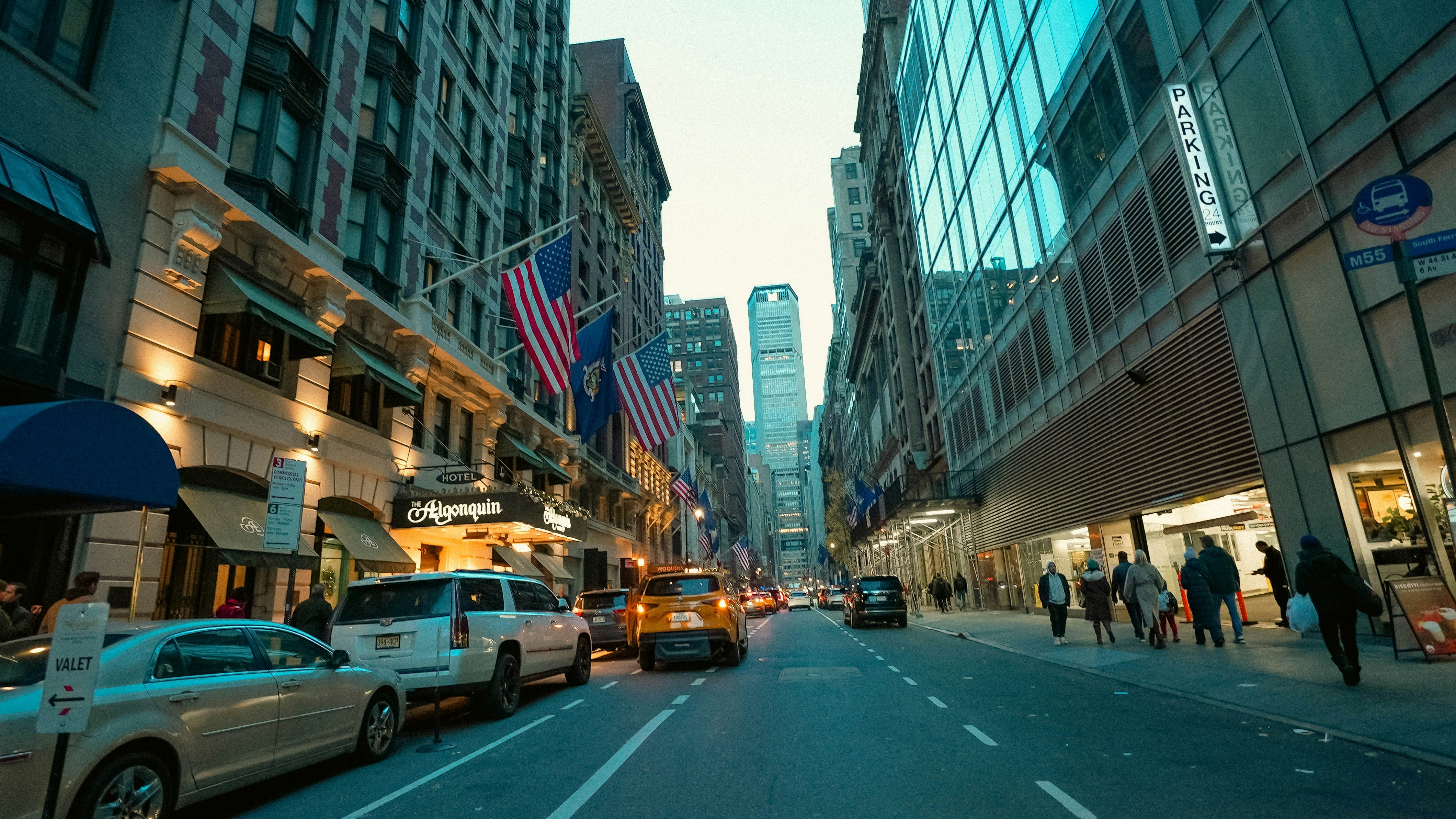 A city street filled with lots of tall buildings