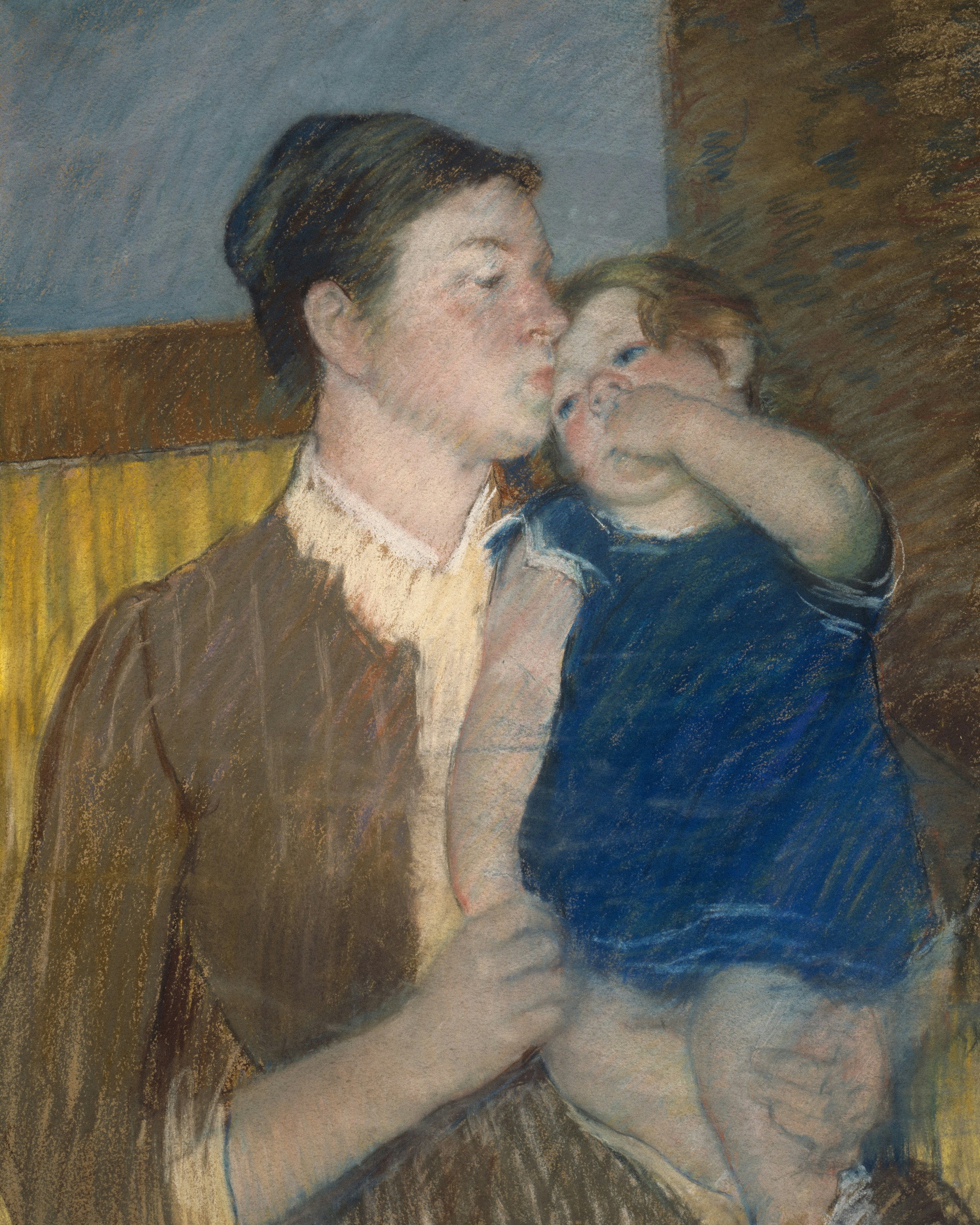 Mother kissing her child on the forehead