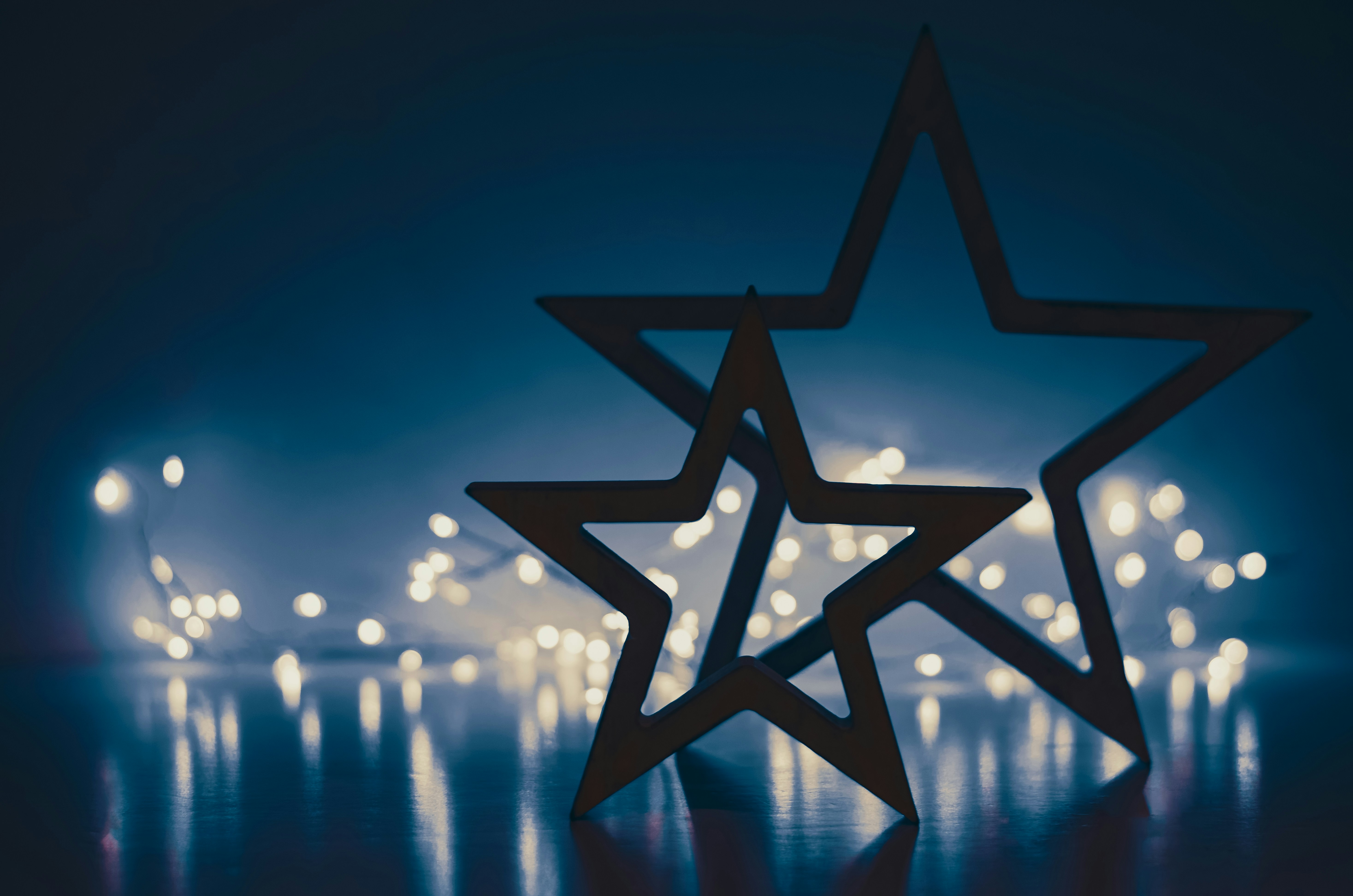 A picture of a star with lights in the background