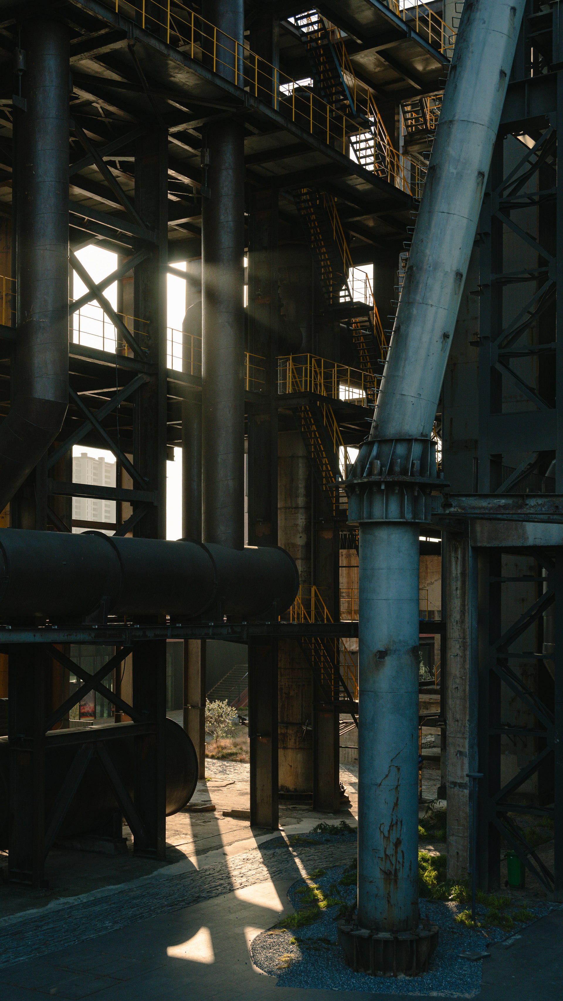 Industrial refinery building with complex piping infrastructure