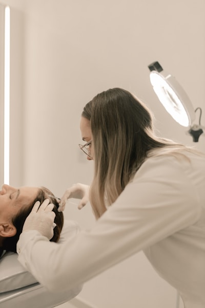 Skin toning laser treatment on a patient's face