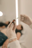 A person holding a cigarette in their hand