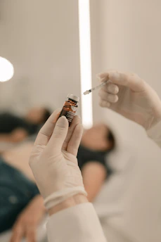 A person holding a cigarette in their hand