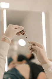 A woman is holding a sys in her hand