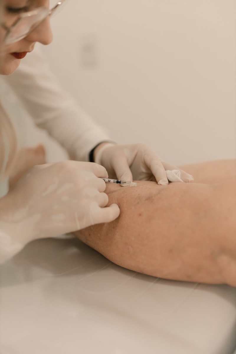 A healthcare professional administering an injection in a clinical setting