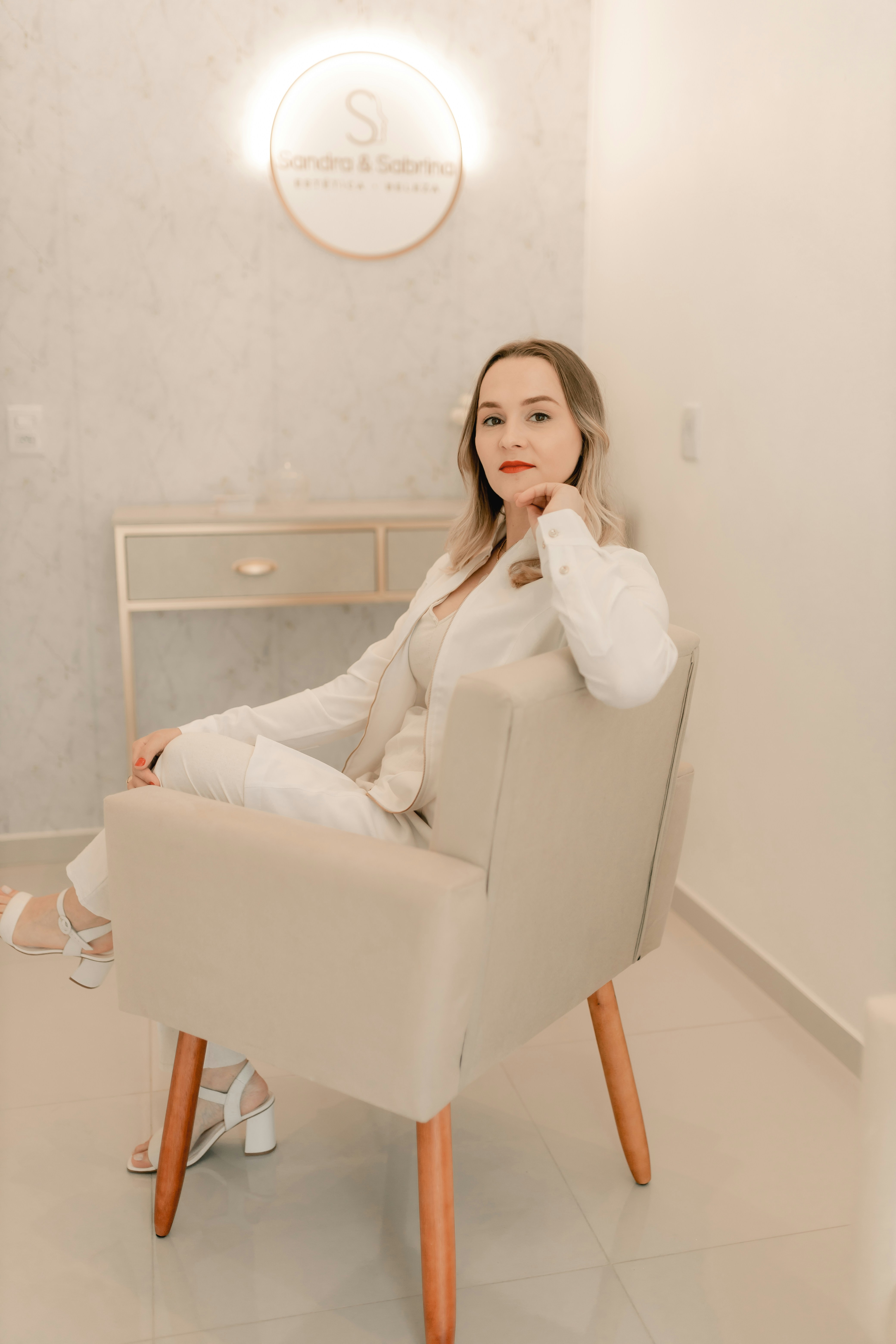 A woman sitting in a chair in a room photo – Free Image on Unsplash