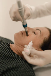 A woman getting a botilage injection from a doctor