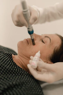 A woman getting a botilage injection from a doctor