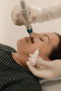 A woman getting a botilage injection from a doctor