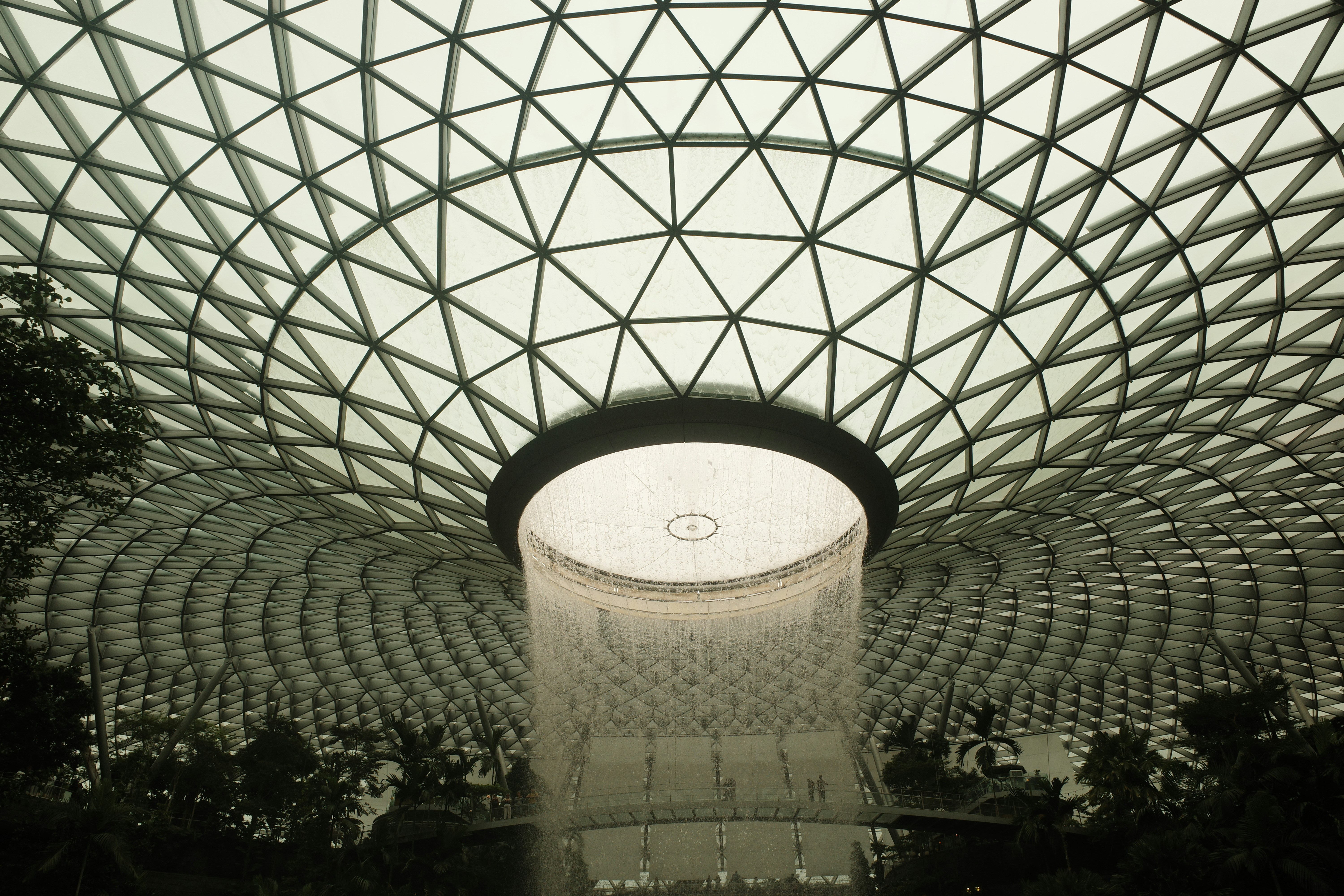 The ceiling of a building with a large glass dome