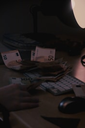 A person typing on a keyboard in front of a computer monitor