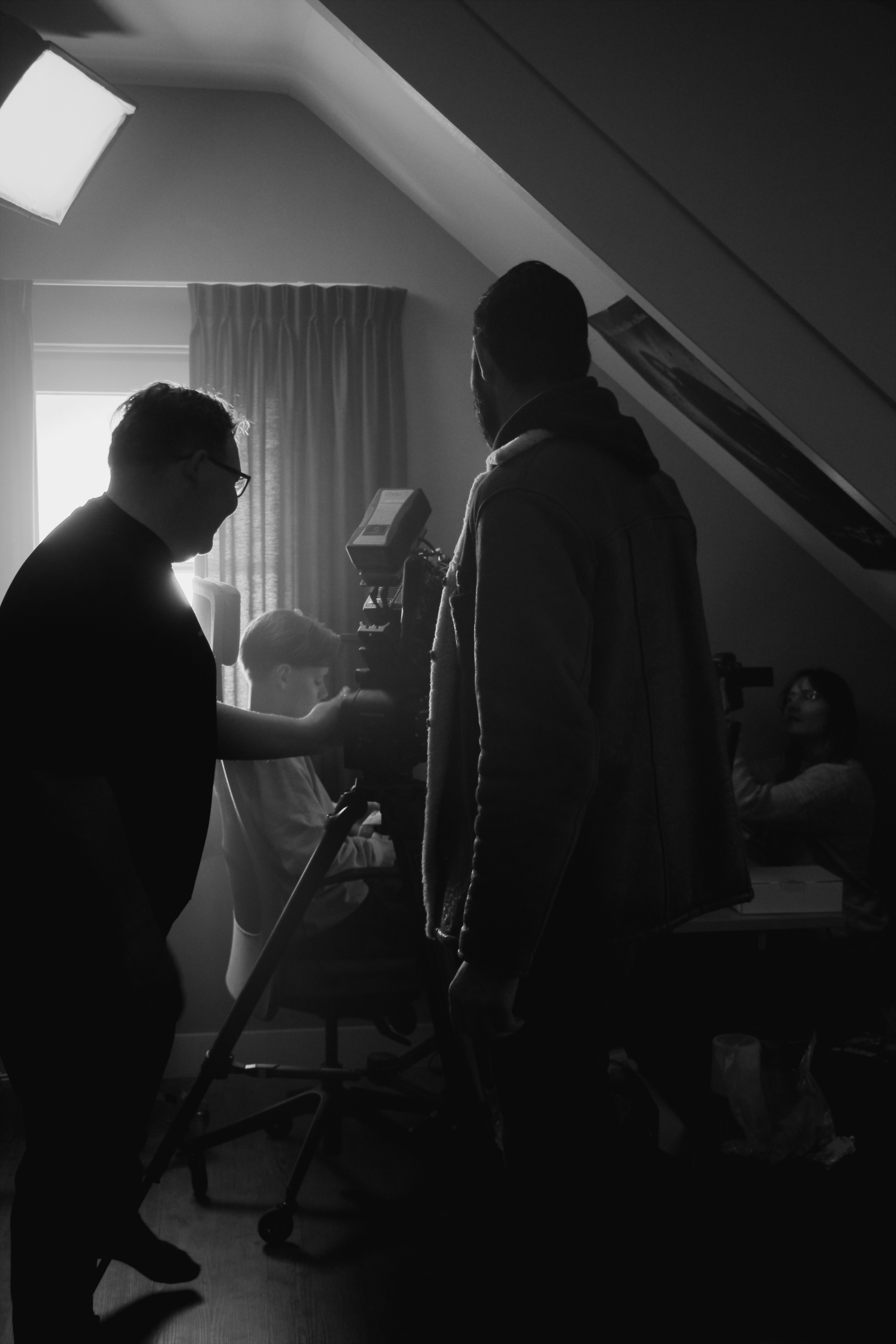 A couple of men standing next to each other in a room