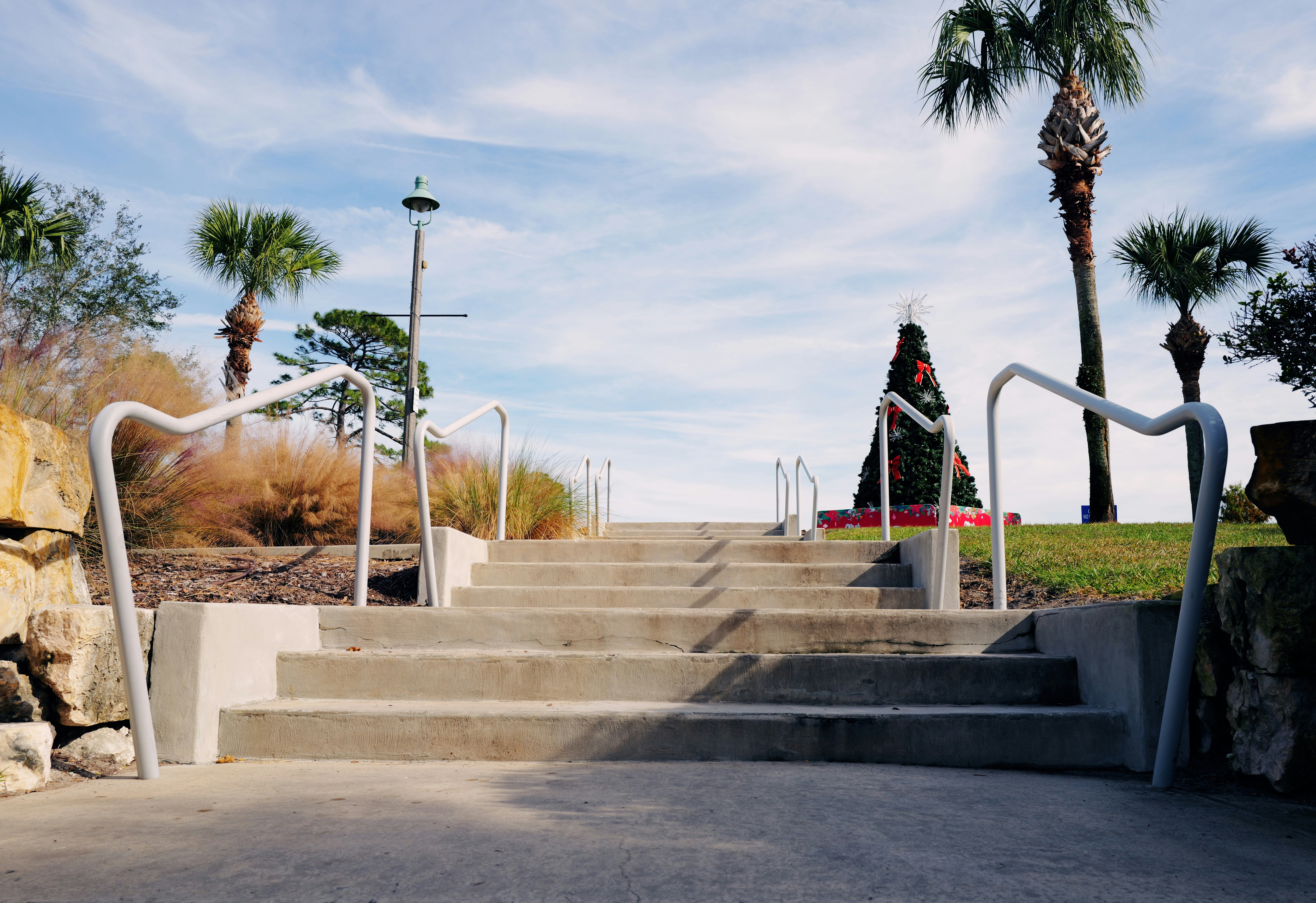 A man riding a skateboard down a set of stairs