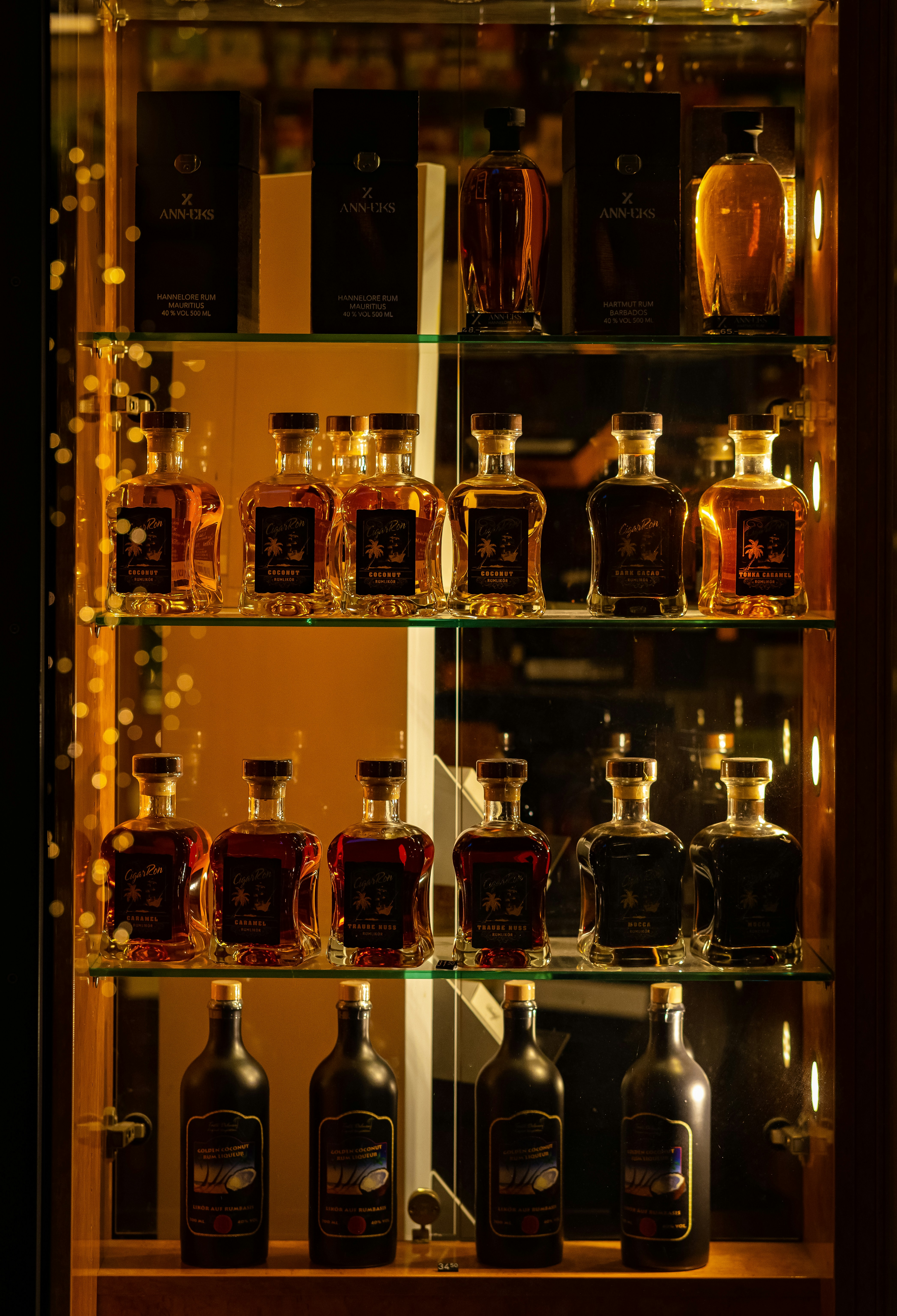 glass shelf filled with liquor