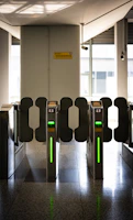 A row of turns at an airport with green lights